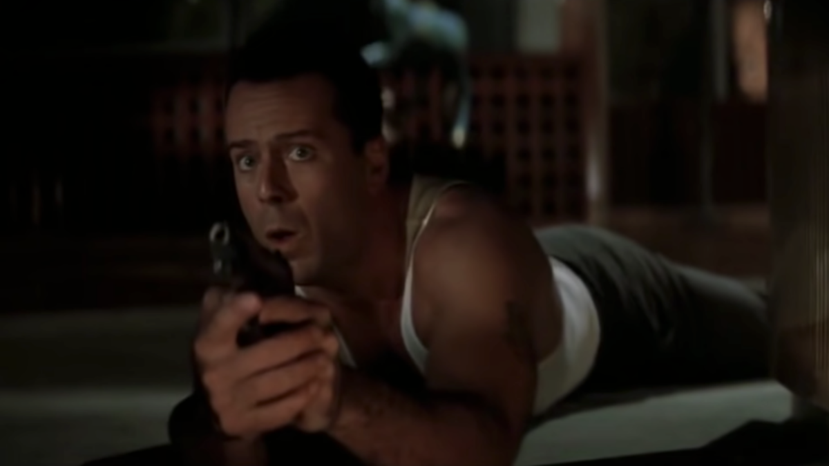 Bruce Willis holding a gun in Die Hard